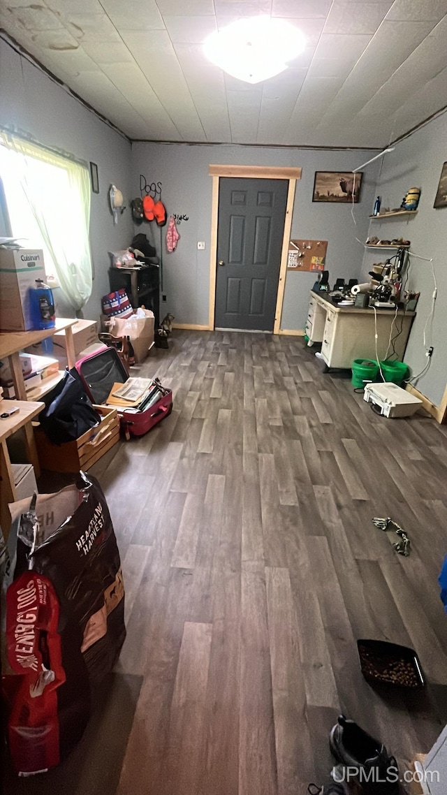 miscellaneous room with wood finished floors and baseboards