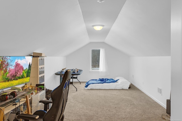 carpeted bedroom with lofted ceiling, baseboards, and visible vents