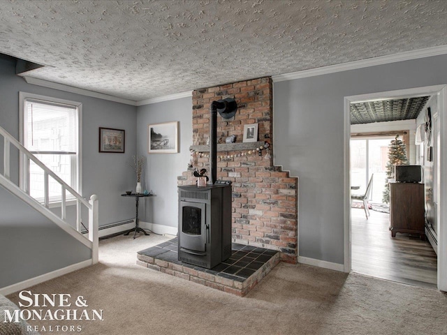 unfurnished living room with a wood stove, crown molding, and carpet flooring