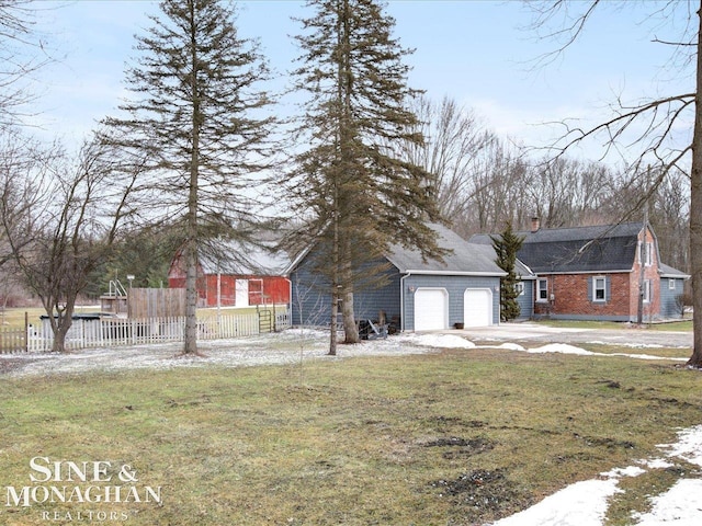 view of front of home with fence, a chimney, and a front lawn