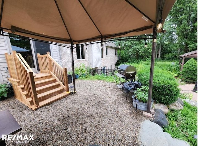 view of patio / terrace featuring grilling area and a gazebo