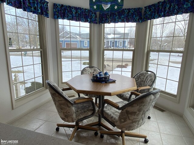 dining area with baseboards and visible vents