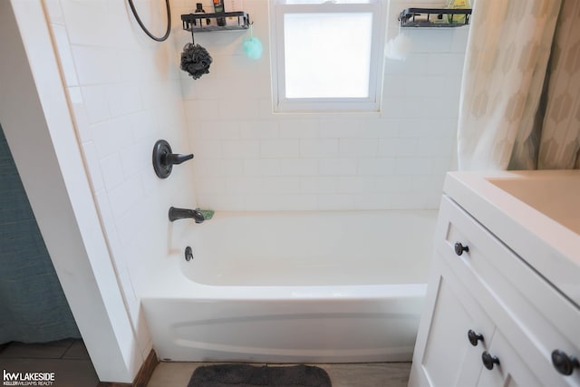 full bathroom with shower / tub combo with curtain and vanity