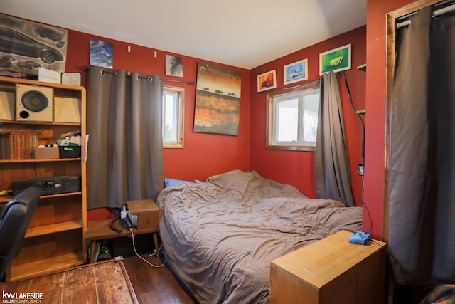 bedroom with wood finished floors