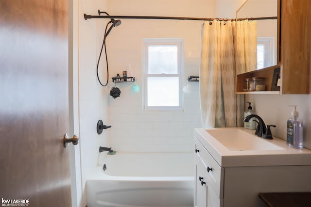 full bath featuring shower / tub combo with curtain and vanity