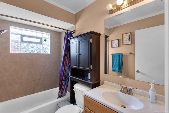 bathroom with toilet, shower / tub combo with curtain, and vanity