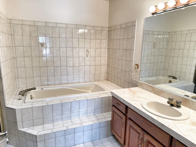 full bathroom with a whirlpool tub and vanity