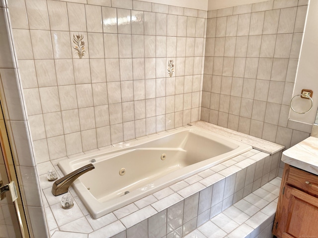 bathroom with a jetted tub and vanity