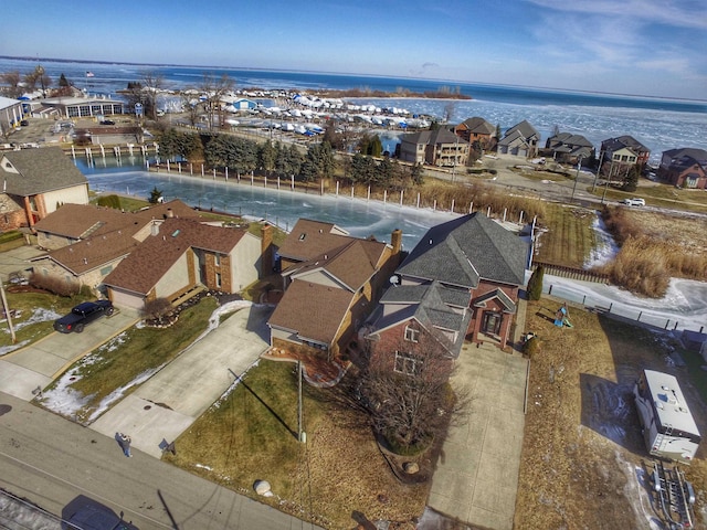 aerial view with a water view and a residential view