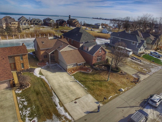 aerial view with a water view and a residential view