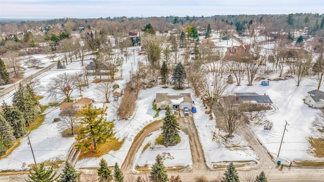 snowy aerial view with a residential view