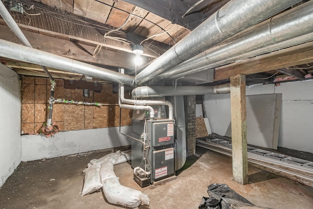 unfinished below grade area featuring heating unit