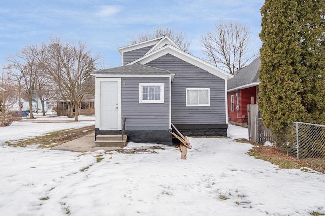 exterior space with entry steps and fence