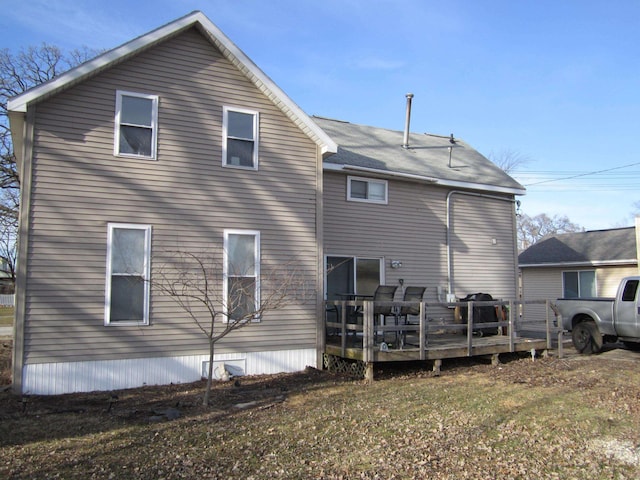 rear view of property with a deck