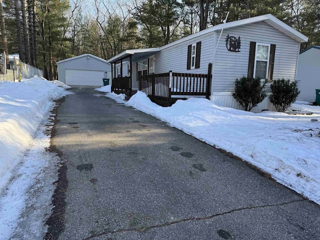 view of front of home featuring a garage and an outdoor structure