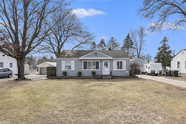 view of front of house with a chimney, a front lawn, and roof with shingles