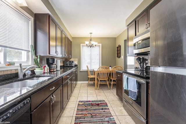 kitchen with stainless steel appliances, a sink, dark brown cabinetry, and light tile patterned floors