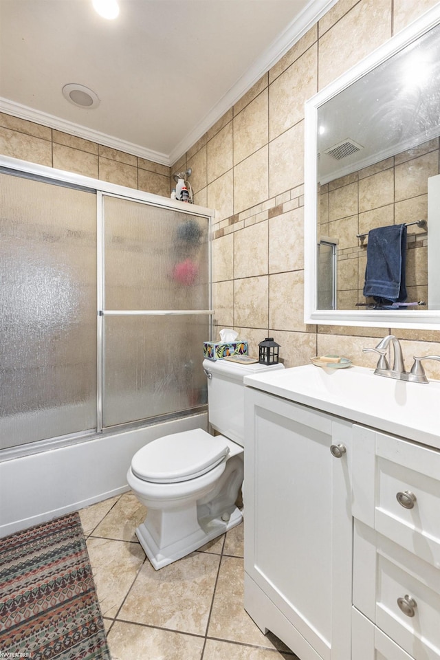 full bathroom with crown molding, tile walls, visible vents, enclosed tub / shower combo, and tile patterned flooring