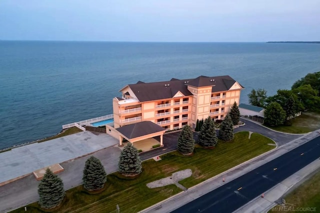 birds eye view of property featuring a water view