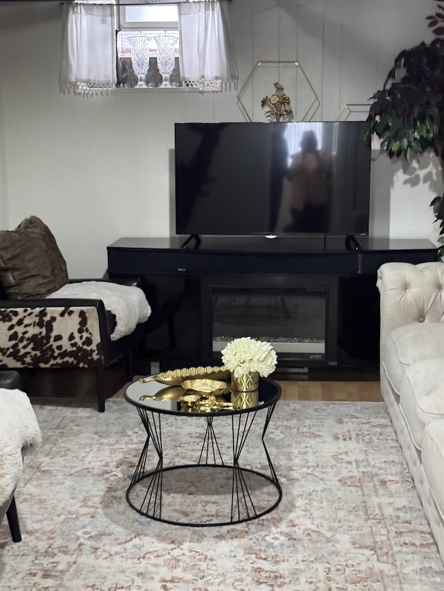 living area with a glass covered fireplace