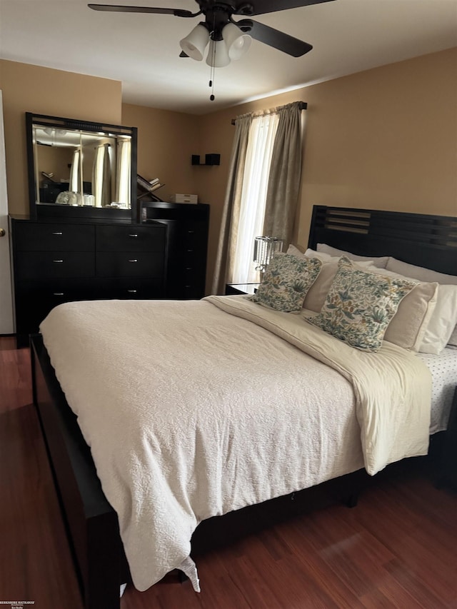 bedroom with dark wood finished floors and ceiling fan