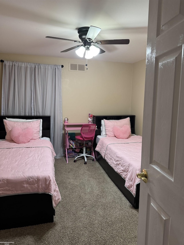 bedroom featuring ceiling fan, carpet flooring, and visible vents