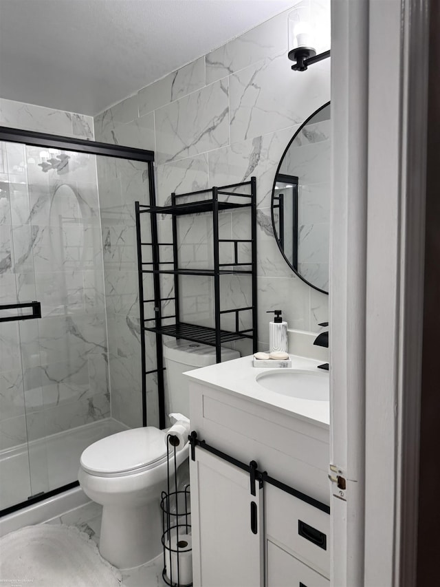 full bathroom with marble finish floor, a marble finish shower, and vanity