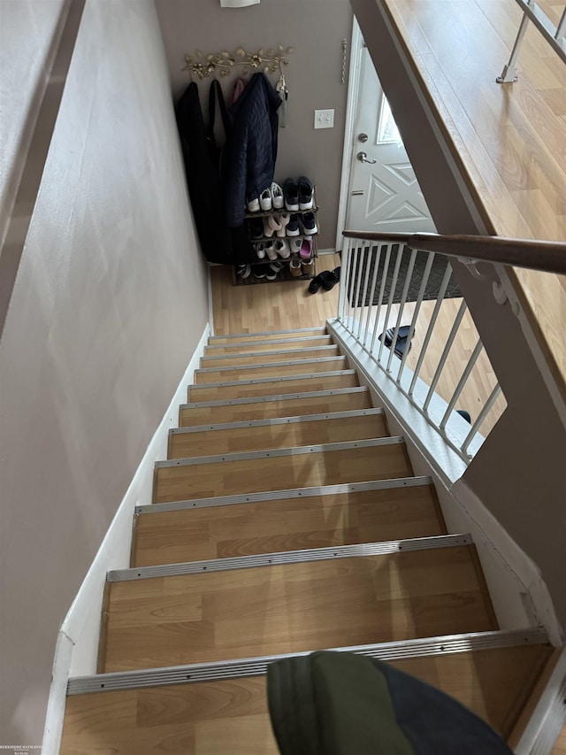 stairs with wood finished floors