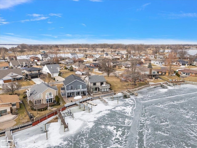 snowy aerial view featuring a residential view