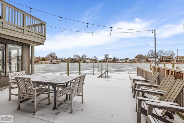 view of patio featuring outdoor dining area and a wooden deck