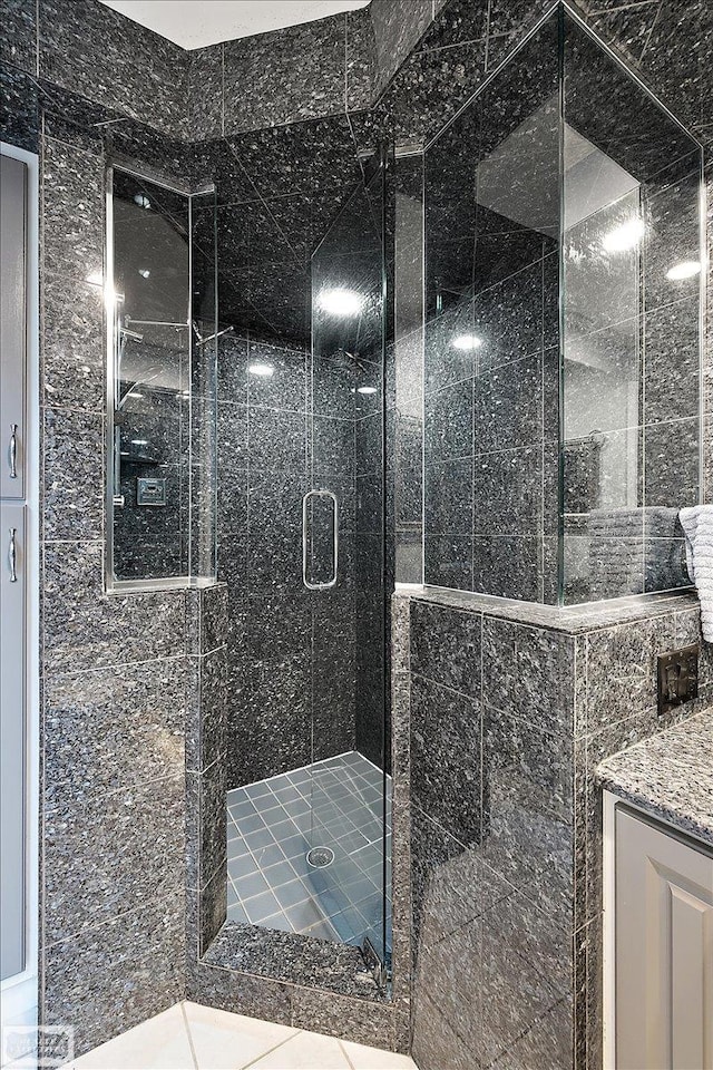 full bath with a shower stall