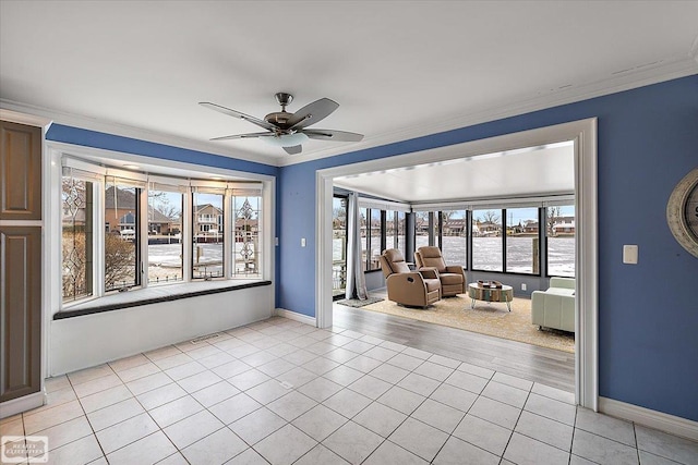 empty room with a ceiling fan, visible vents, crown molding, and light tile patterned floors