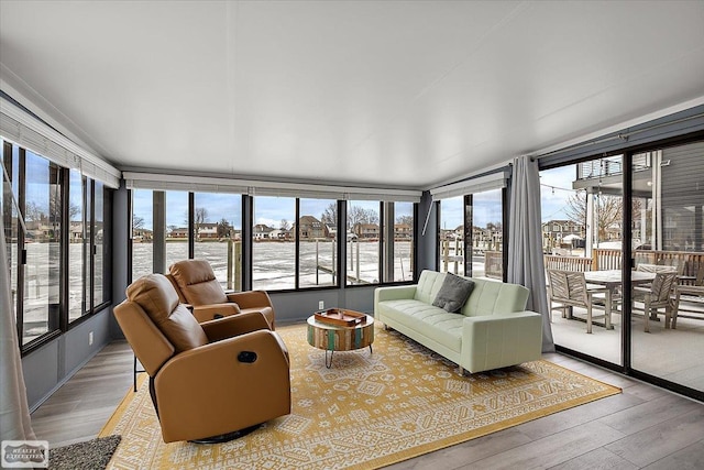 sunroom / solarium featuring plenty of natural light