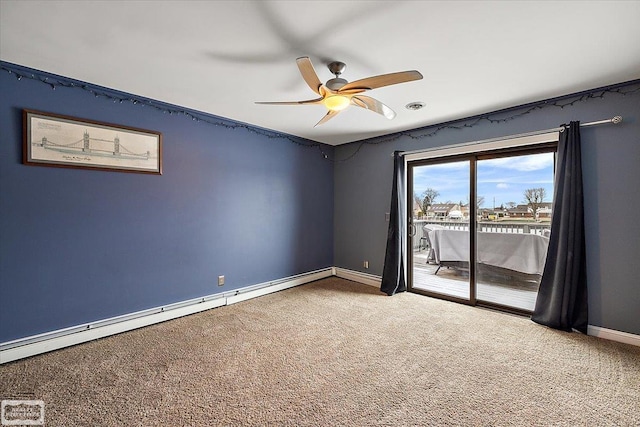 carpeted spare room with a baseboard radiator, ceiling fan, and baseboards