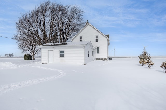 view of snow covered house