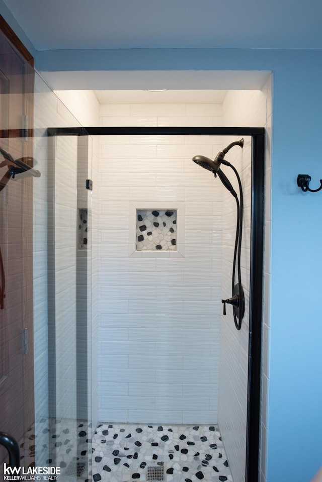 full bathroom featuring a shower stall