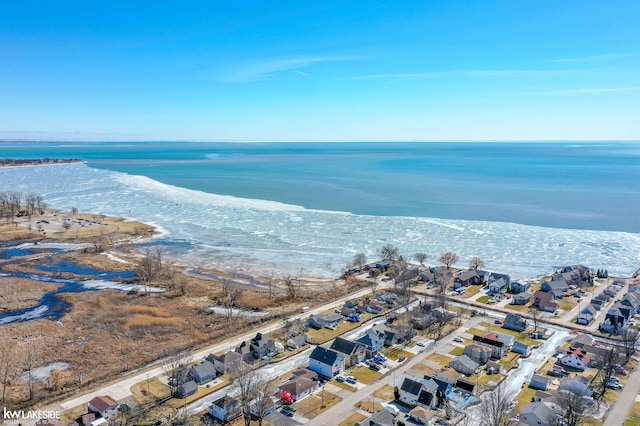 birds eye view of property with a residential view and a water view