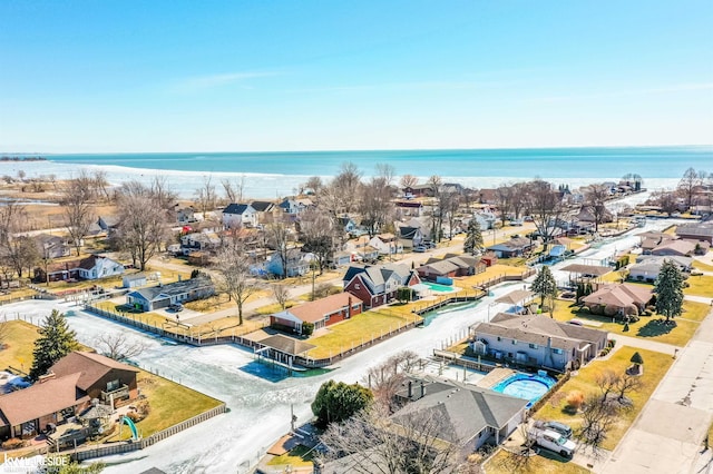 birds eye view of property with a residential view and a water view