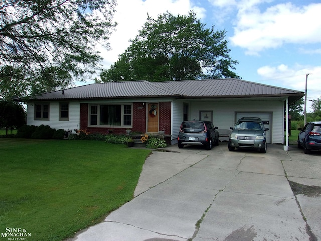 ranch-style home featuring driveway, a garage, metal roof, a front yard, and brick siding