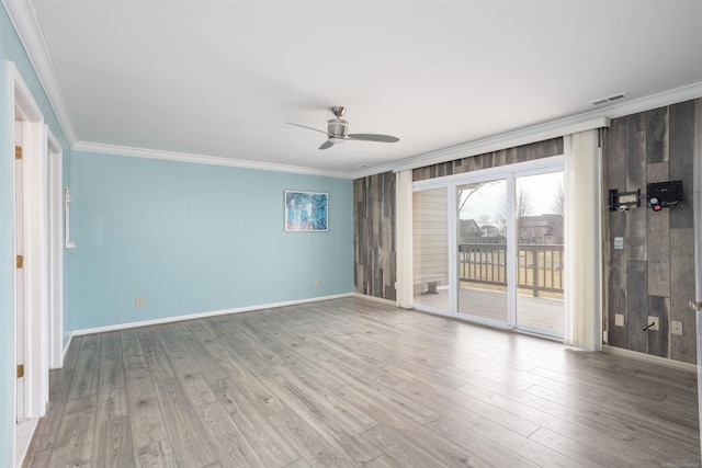 25540 Waterview Dr, Harrison Twp, MI 48045 - empty room featuring baseboards, ornamental molding, a ceiling fan, and wood finished floors