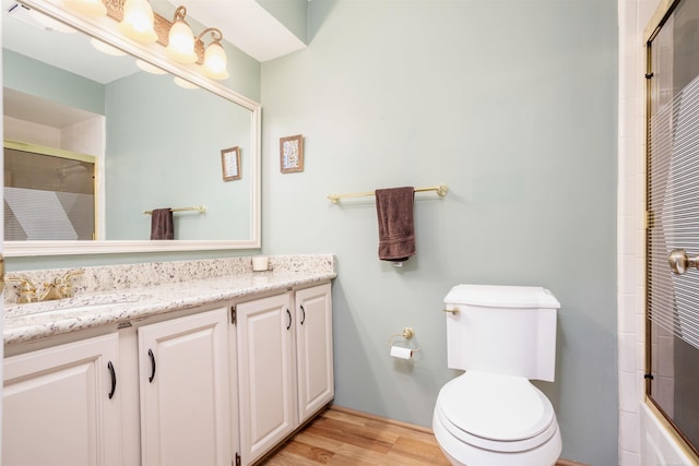 25540 Waterview Dr, Harrison Twp, MI 48045 - bathroom with toilet, wood finished floors, a shower with shower door, and vanity