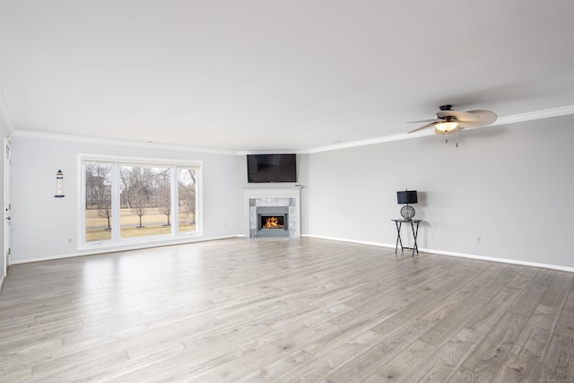 25540 Waterview Dr, Harrison Twp, MI 48045 - unfurnished living room featuring crown molding, baseboards, and ceiling fan