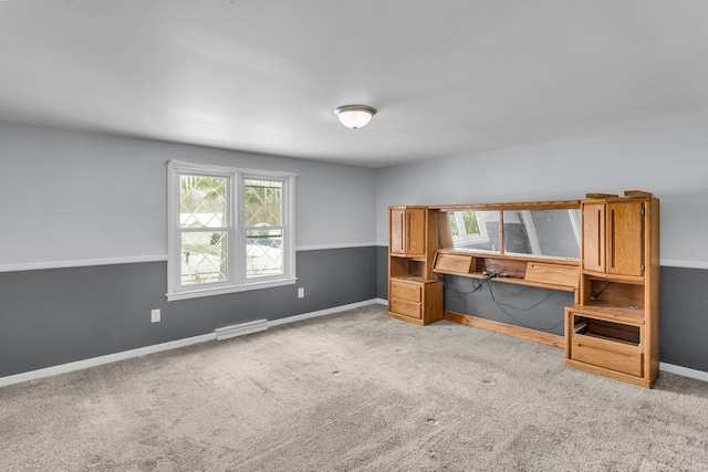 unfurnished office featuring carpet floors, visible vents, and baseboards