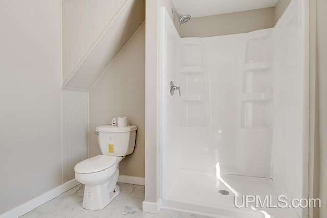 full bathroom with toilet, marble finish floor, a shower stall, and baseboards