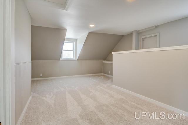 bonus room featuring recessed lighting, wainscoting, carpet flooring, and lofted ceiling