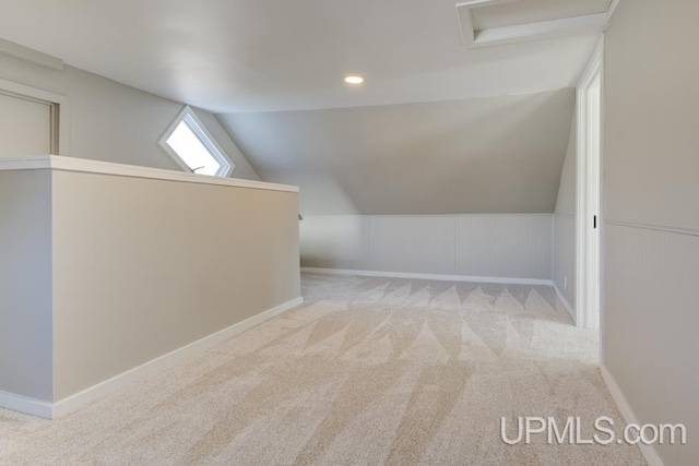 bonus room featuring carpet floors, recessed lighting, vaulted ceiling, and attic access