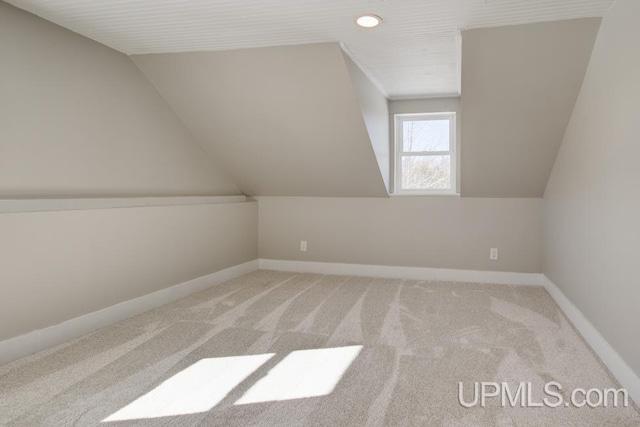 bonus room featuring carpet floors, lofted ceiling, and baseboards