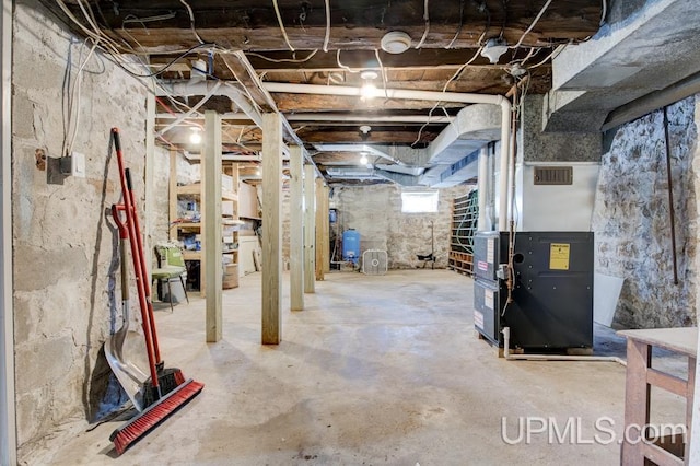 basement featuring heating unit