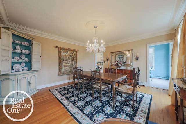 dining room featuring a notable chandelier, crown molding, a baseboard radiator, and light wood-style floors