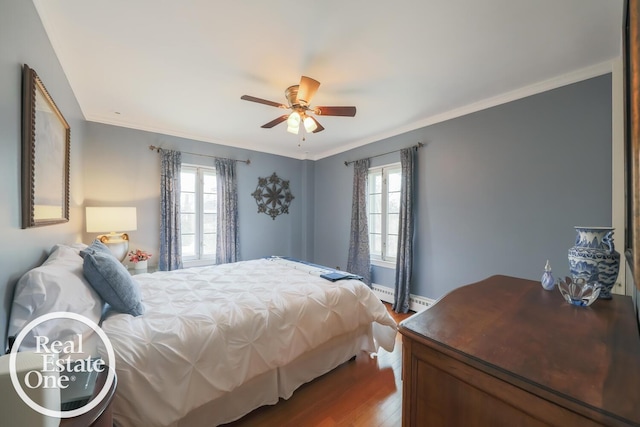 bedroom with a baseboard radiator, ceiling fan, ornamental molding, and wood finished floors